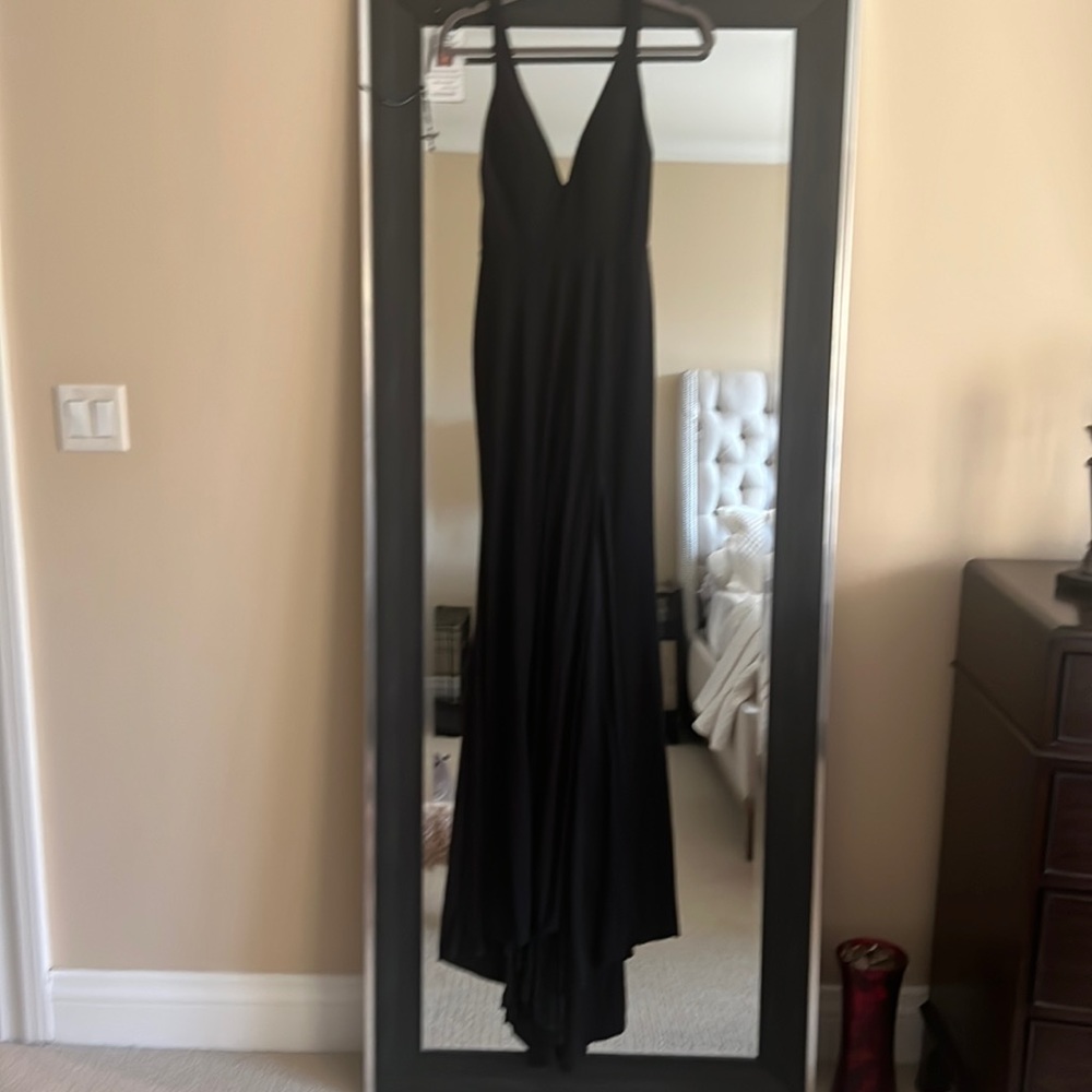 Long black dress with a tail worn once in great condition